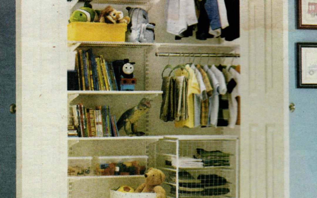 A closet with many shelves and clothes hanging on it.